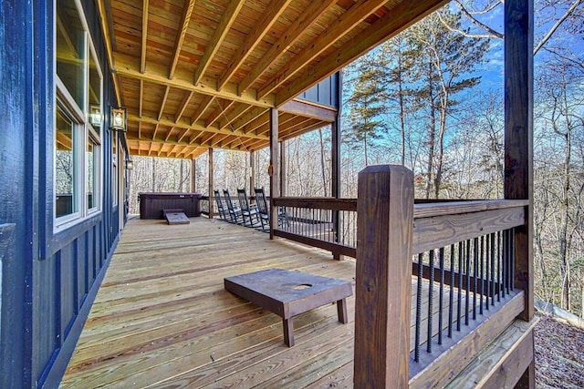 wooden terrace with a hot tub