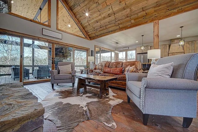 living room featuring high vaulted ceiling, wood ceiling, a healthy amount of sunlight, and wood finished floors