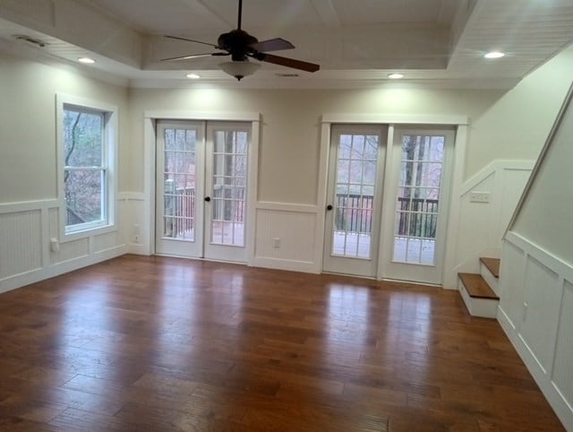 entryway featuring a raised ceiling, french doors, and dark hardwood / wood-style floors