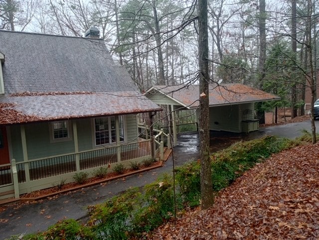 view of property exterior featuring a porch