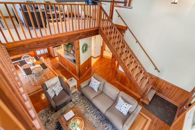 living area with wood finished floors and stairs