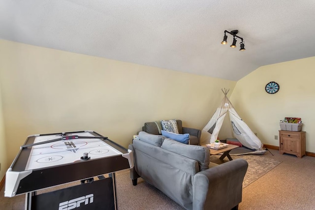 game room featuring carpet floors, lofted ceiling, and baseboards
