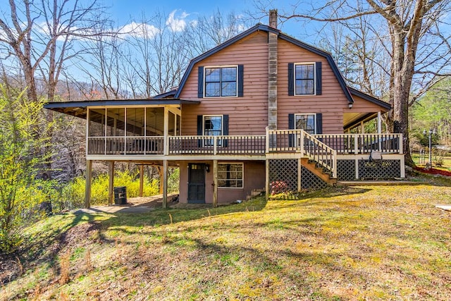 back of house with a gambrel roof, a wooden deck, and stairway