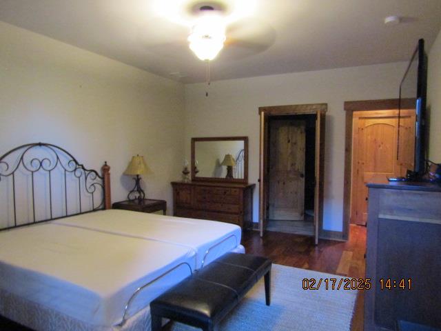 bedroom featuring dark wood-type flooring