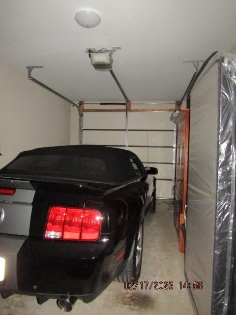 garage featuring a garage door opener