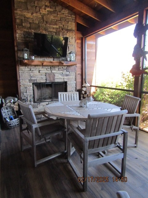 view of patio featuring an outdoor stone fireplace