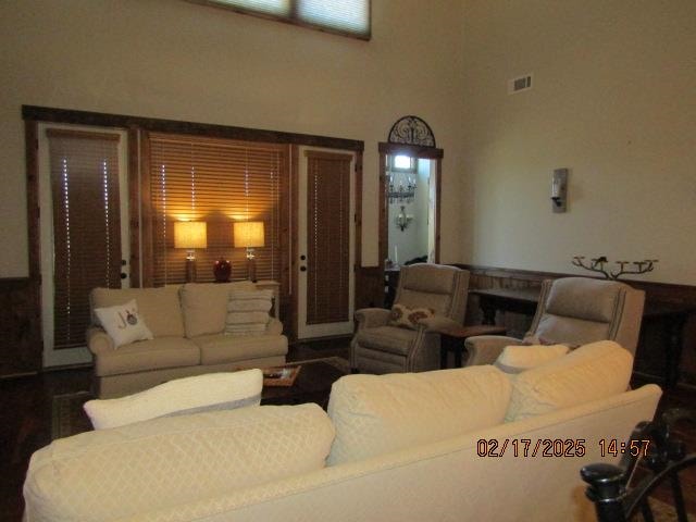 living room featuring a high ceiling