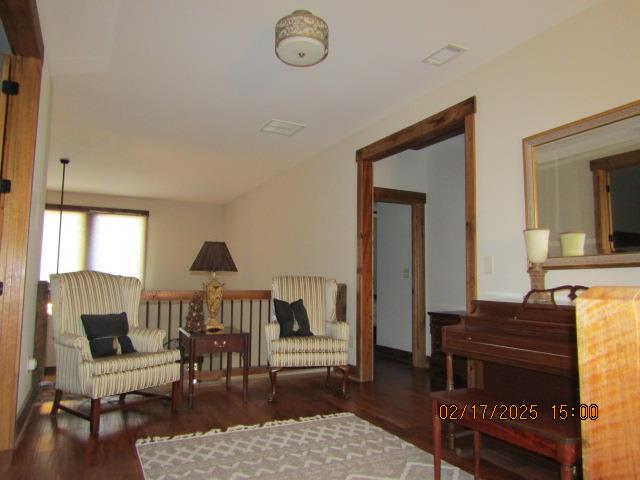 sitting room with dark hardwood / wood-style floors