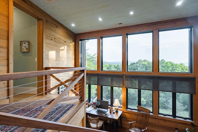 interior space with visible vents, a healthy amount of sunlight, and wood ceiling