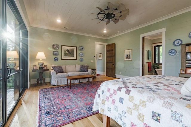 bedroom featuring wood ceiling, wood finished floors, visible vents, and ornamental molding