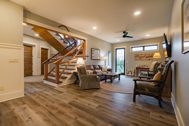 living area featuring stairway, recessed lighting, wood finished floors, and ceiling fan