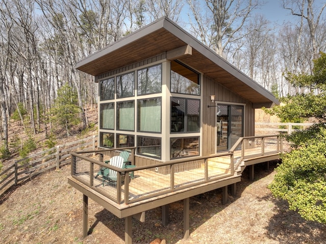 exterior space featuring a deck and fence