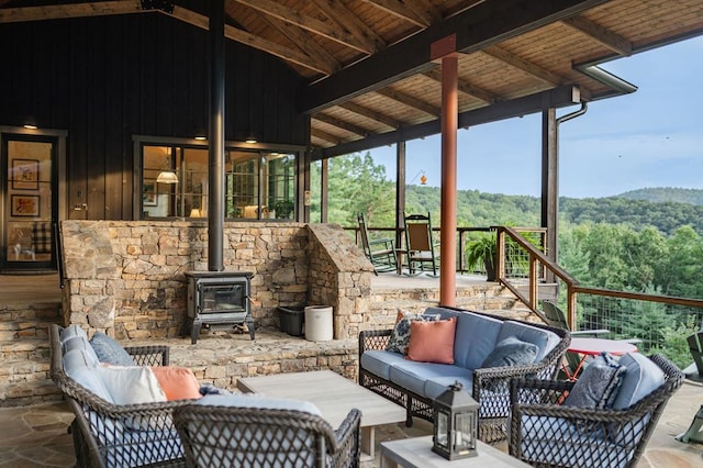 view of patio featuring an outdoor living space and a view of trees