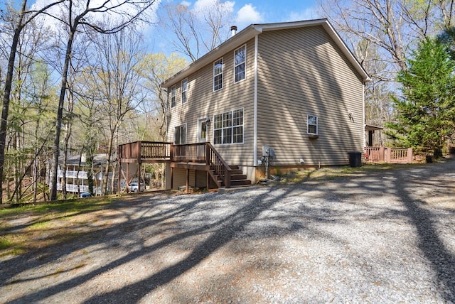 view of side of home featuring a wooden deck