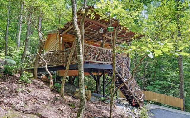 back of house featuring a wooden deck