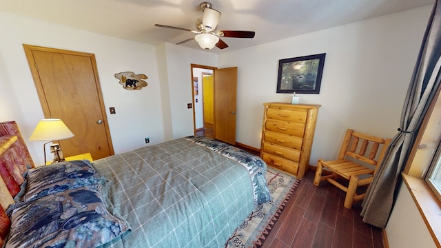 bedroom featuring ceiling fan and a textured ceiling