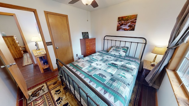 bedroom with ceiling fan and dark hardwood / wood-style flooring