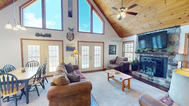 living room with a wall unit AC, a fireplace, wood ceiling, and french doors