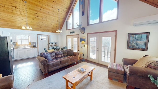 living room with an AC wall unit, wood-type flooring, a chandelier, wooden ceiling, and french doors