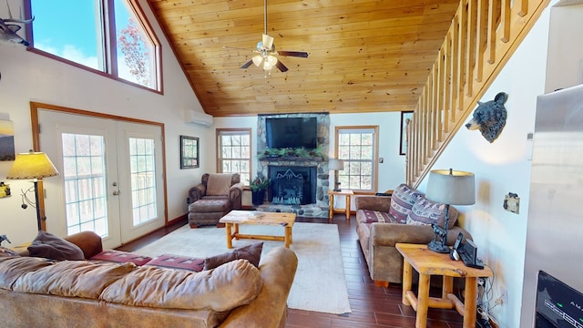 living room with wood ceiling, dark wood-type flooring, high vaulted ceiling, a stone fireplace, and french doors