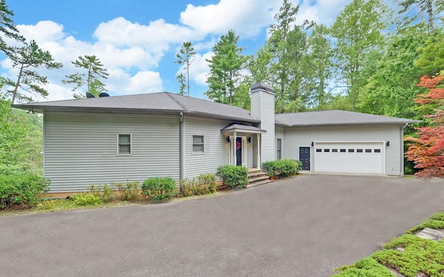 single story home featuring a garage