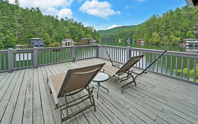 wooden deck featuring a water view