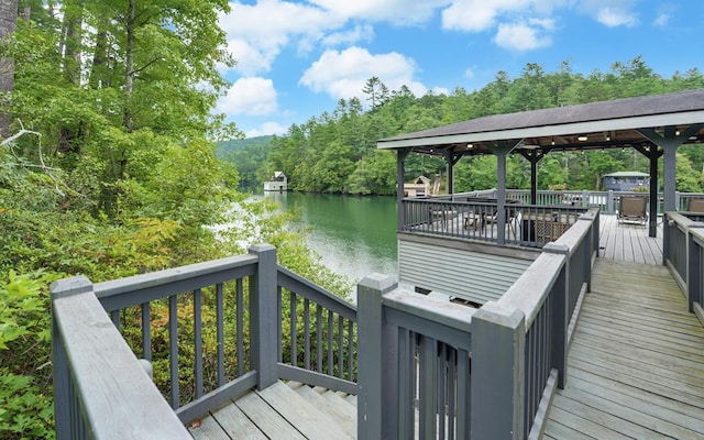 exterior space featuring a gazebo and a water view