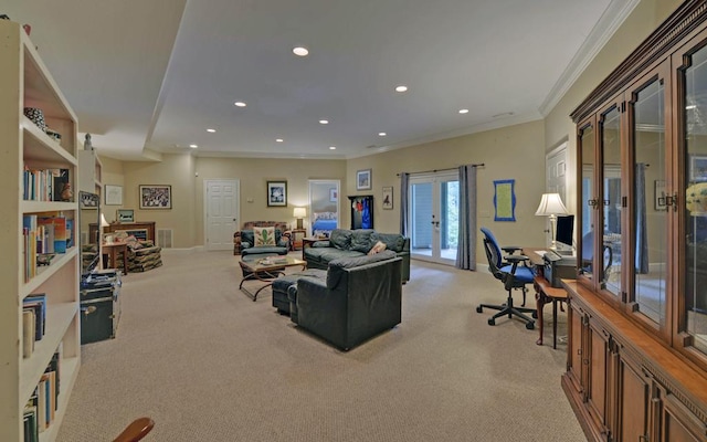 carpeted living room with ornamental molding and french doors