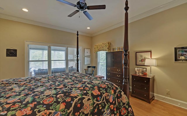 bedroom featuring ceiling fan, ornamental molding, and light wood-type flooring