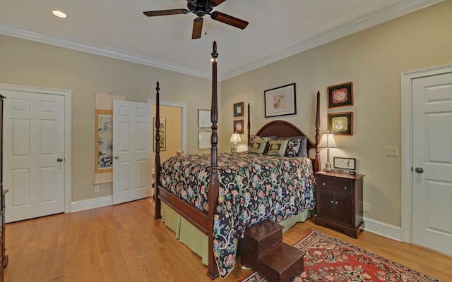 bedroom with ceiling fan, ornamental molding, and light hardwood / wood-style flooring