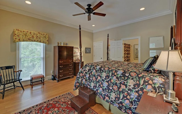 bedroom with ornamental molding, ceiling fan, and light hardwood / wood-style flooring