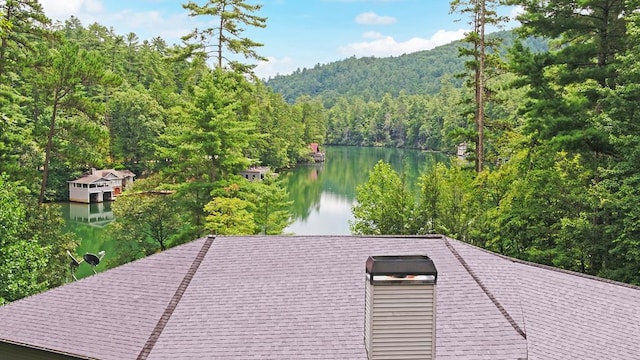 exterior space featuring a water view and a dock