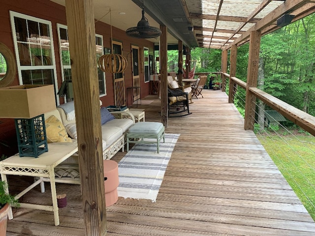 deck with ceiling fan and a pergola