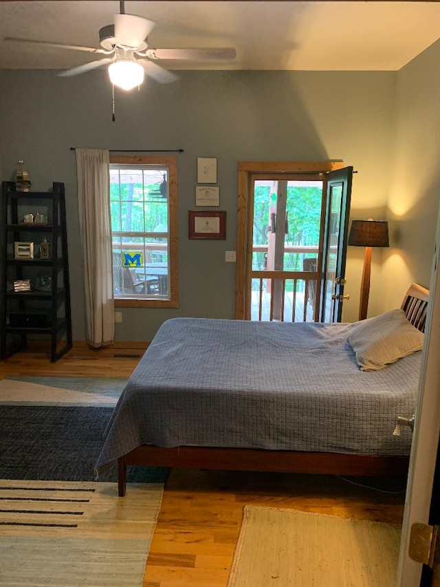 bedroom with hardwood / wood-style floors and ceiling fan