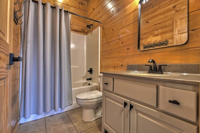 bathroom with toilet, shower / bathtub combination with curtain, vanity, wood walls, and tile patterned flooring