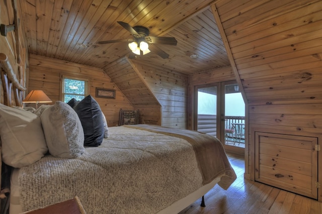 bedroom featuring wood ceiling, wood walls, and multiple windows