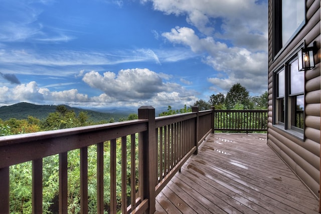 wooden deck with a mountain view