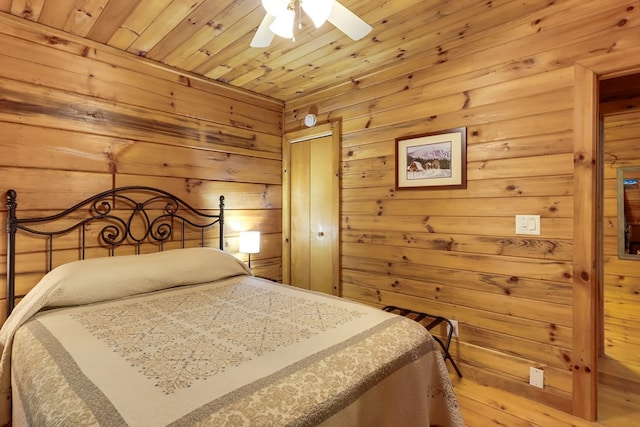488 Joanne Sisson Rd, Blue Ridge, GA 30513 - bedroom with a closet, wooden walls, wooden ceiling, and a ceiling fan