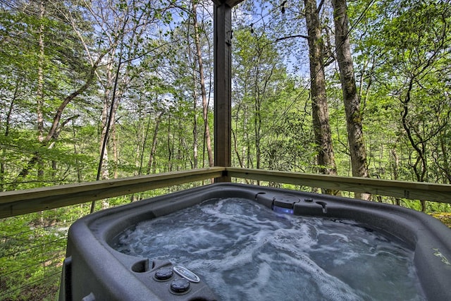 488 Joanne Sisson Rd, Blue Ridge, GA 30513 - exterior details with a jacuzzi and a view of trees