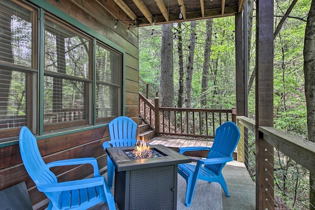488 Joanne Sisson Rd, Blue Ridge, GA 30513 - wooden terrace with an outdoor fire pit and a forest view