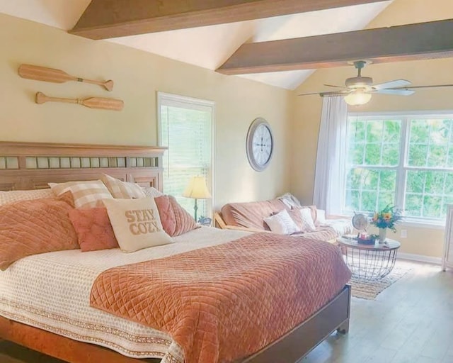 bedroom with lofted ceiling with beams, ceiling fan, wood finished floors, and baseboards