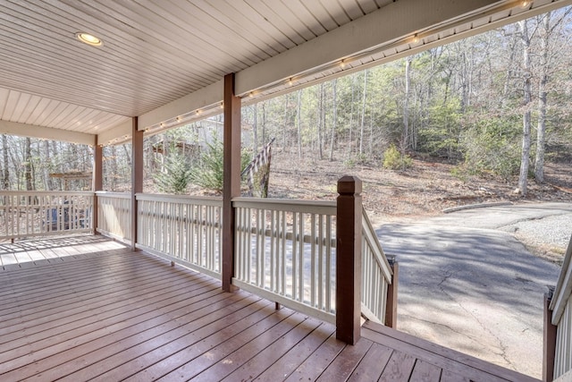 deck featuring a wooded view