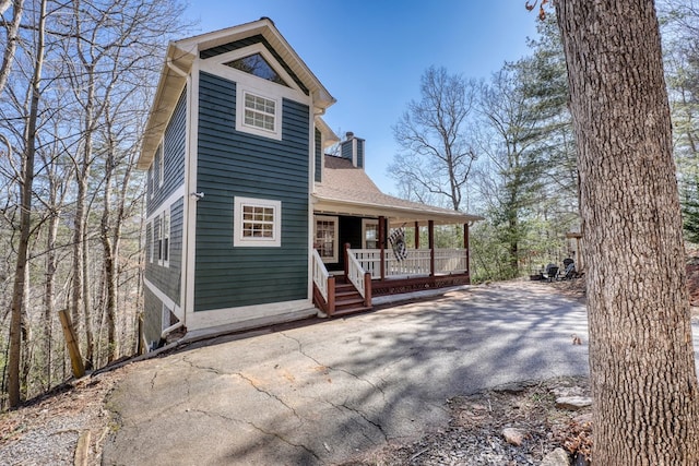 view of front of home featuring a chimney