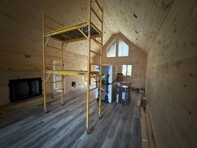 bonus room featuring wood walls, wood ceiling, dark wood-style floors, and vaulted ceiling