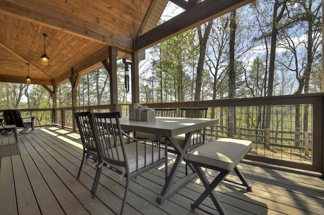 wooden terrace with outdoor dining area