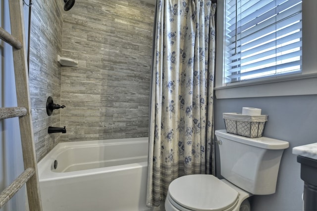 bathroom with shower / bath combination with curtain and toilet
