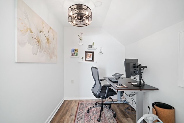 office featuring vaulted ceiling, an inviting chandelier, wood finished floors, and baseboards