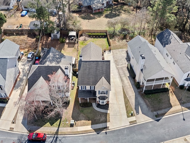 birds eye view of property with a residential view