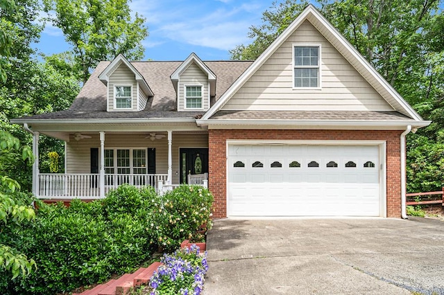 220 Oak Ridge Ln, Ellijay, GA 30536 - view of front of home with brick siding, concrete driveway, covered porch, and roof with shingles