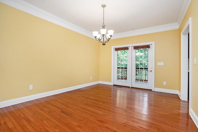 220 Oak Ridge Ln, Ellijay, GA 30536 - empty room with crown molding, a chandelier, and wood finished floors